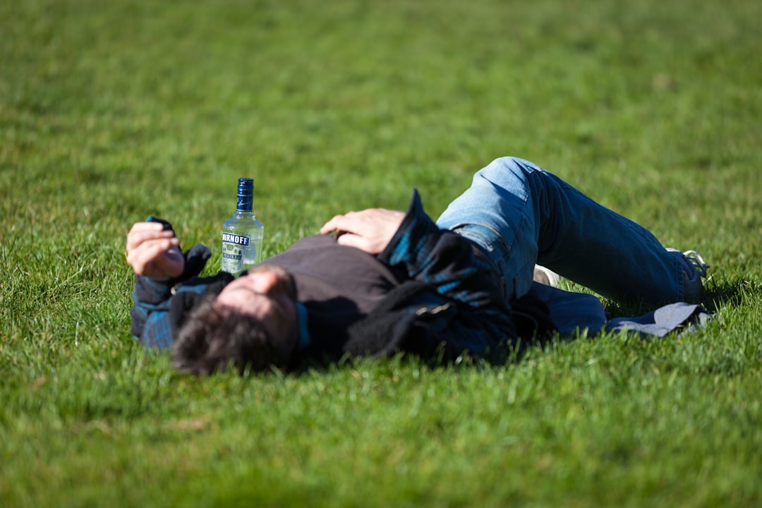 person relaxing with cbd oil dropper