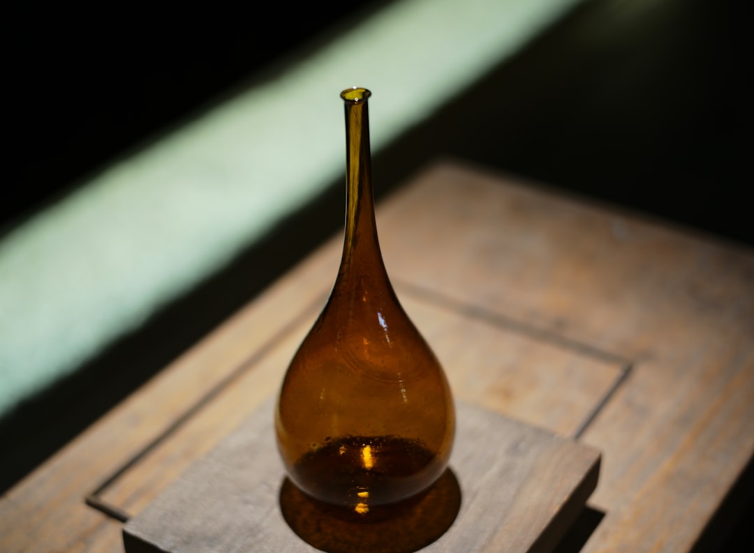 CBD oil dropper bottle on a wooden table