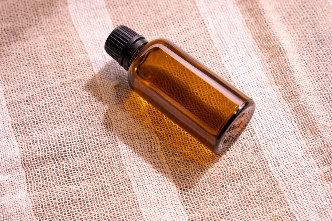 bottle of cold pressed hemp oil with natural color