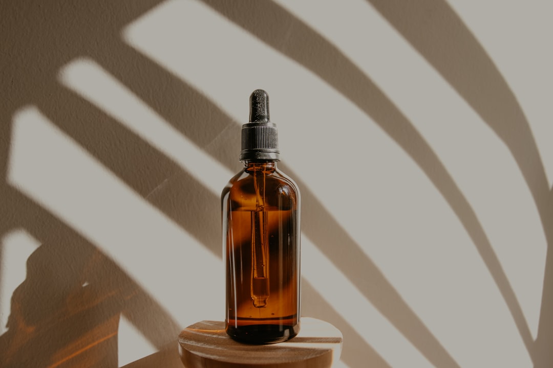 marijuana-based CBD oil tincture bottle on wooden table